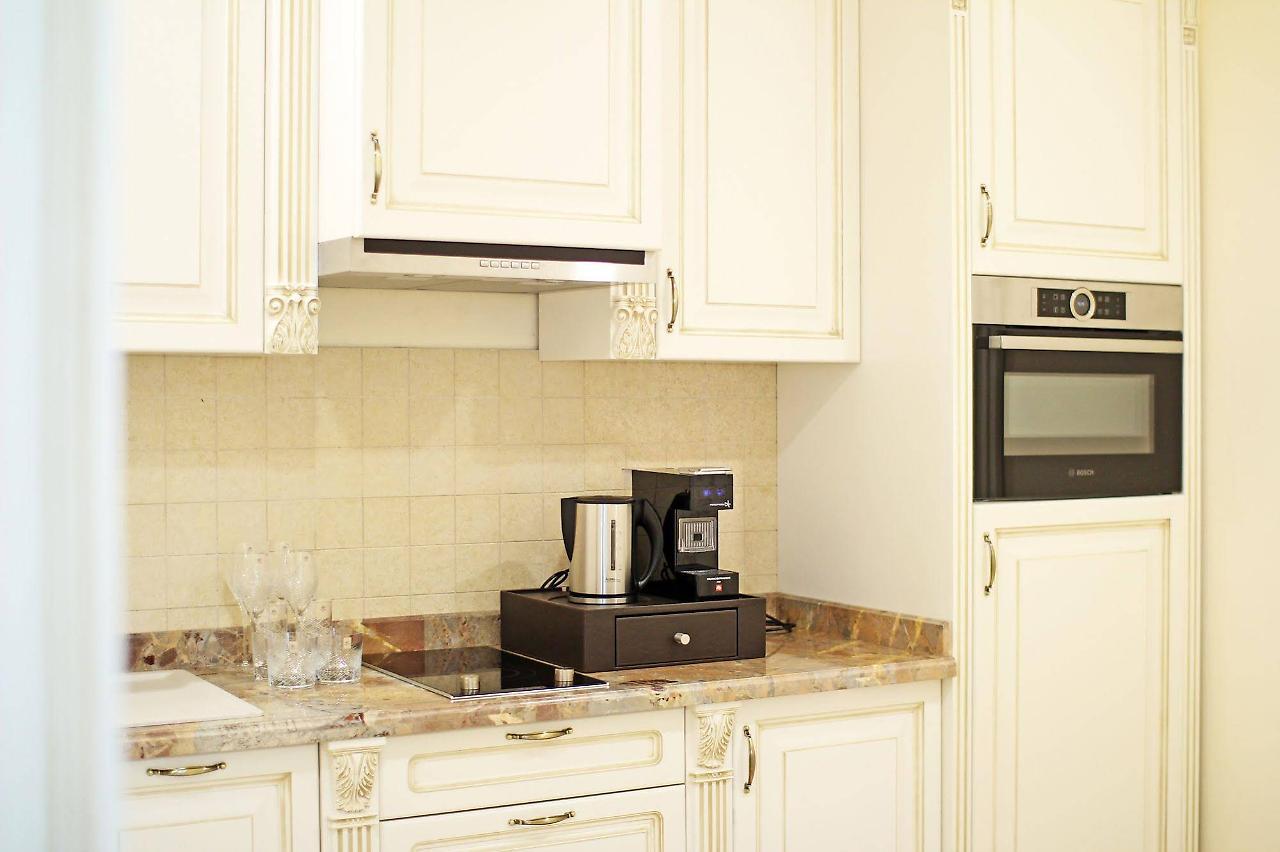 Orion Hotel Bishkek Esterno foto A coffee machine in a kitchen