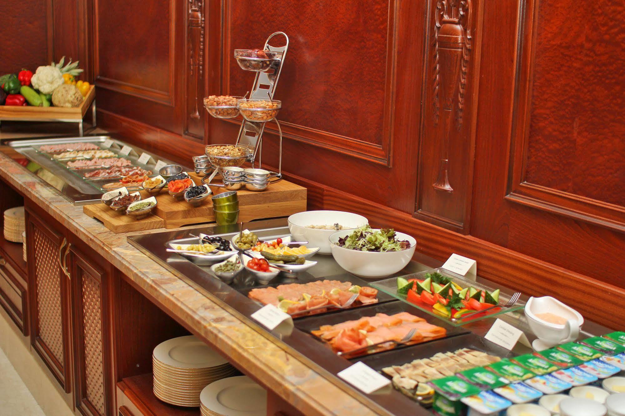 Orion Hotel Bishkek Esterno foto A buffet at a hotel