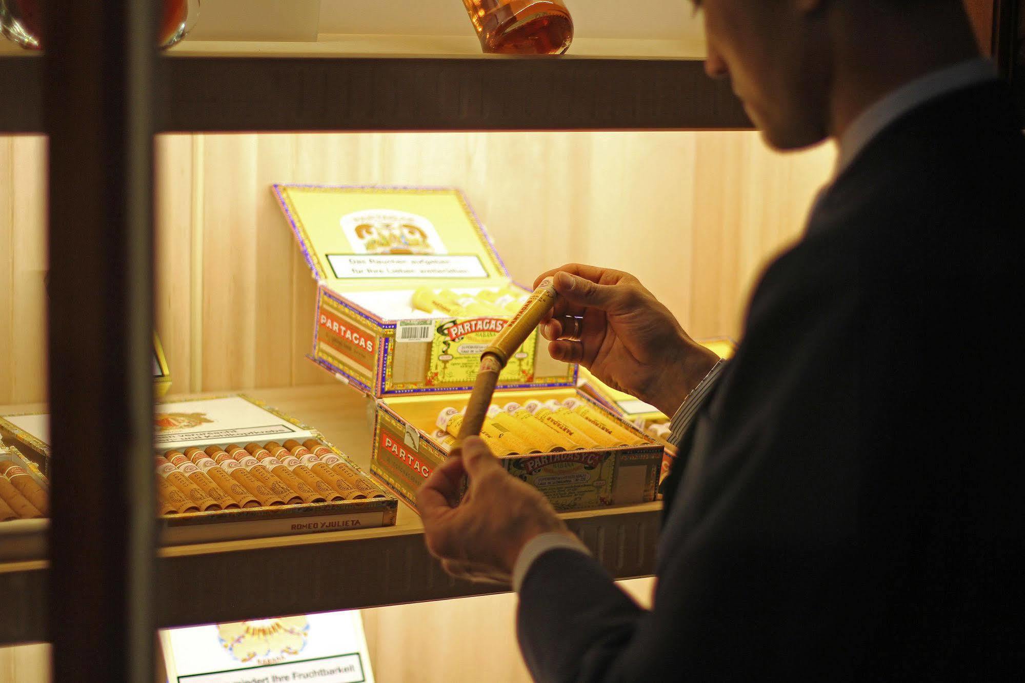 Orion Hotel Bishkek Esterno foto A cigar shop in Madrid, Spain